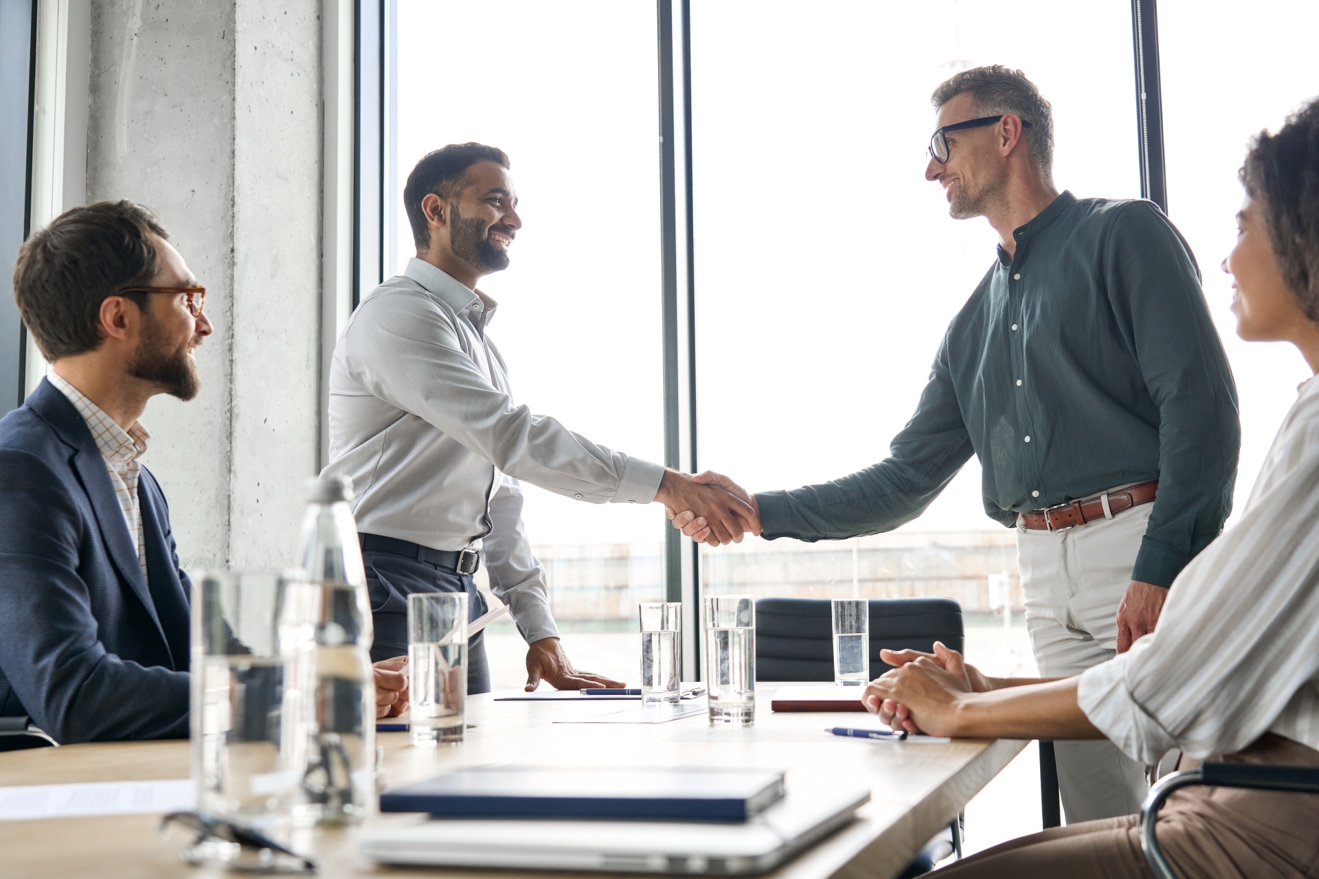 An image of 2 professionals discussing work in trade finance.