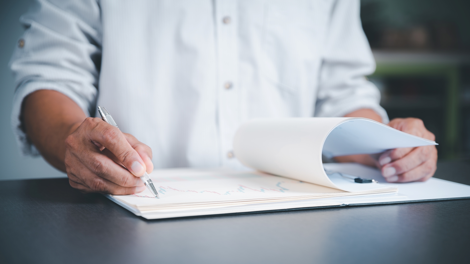 An image of documentation work in a corporation, in trade finance.