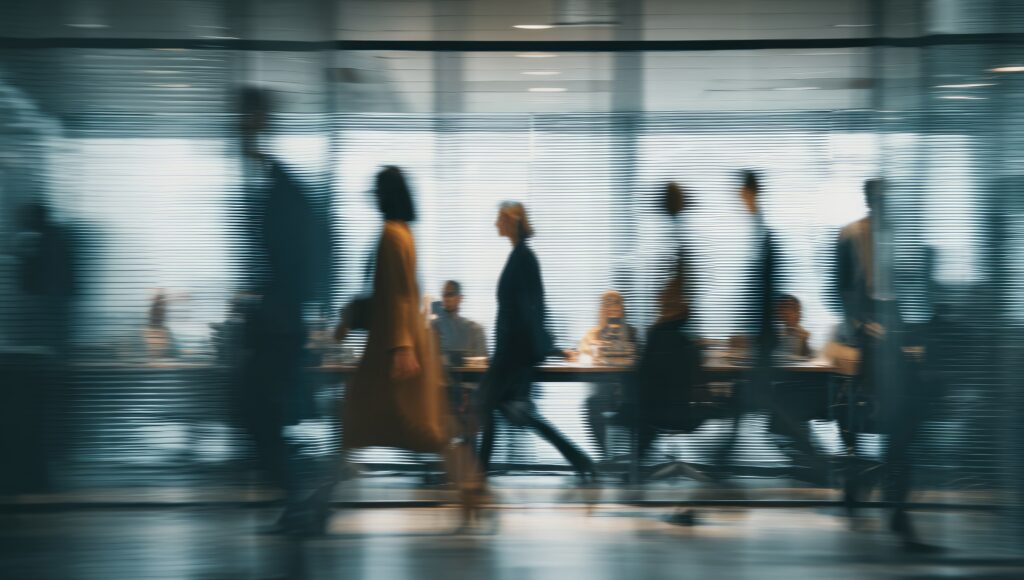 Corporate trade finance professionals walking in a busy central district.
